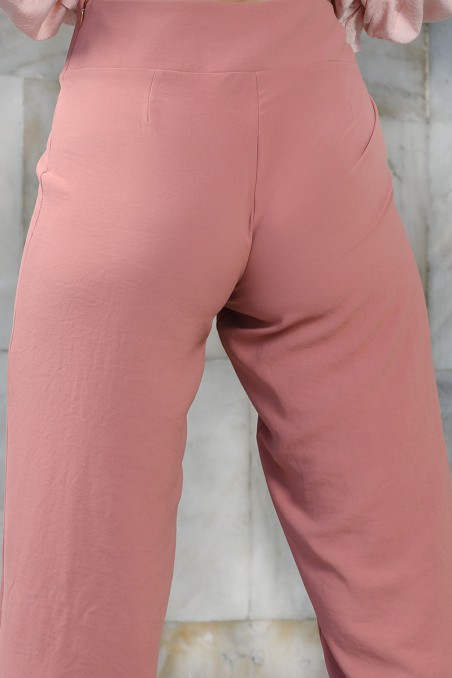 Spodnie damskie z lejącego materiału w kolorze ceglastym